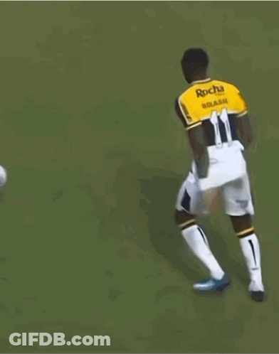 Soccer Player Number 11 Kicks Ball GIF