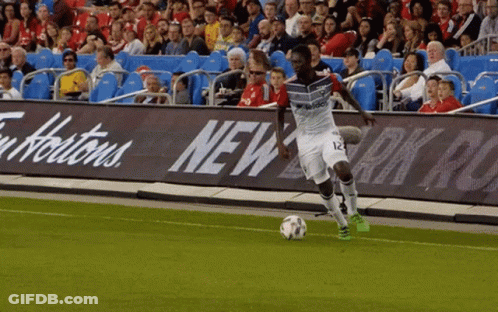 Soccer Player Number 12 Kicking Ball GIF