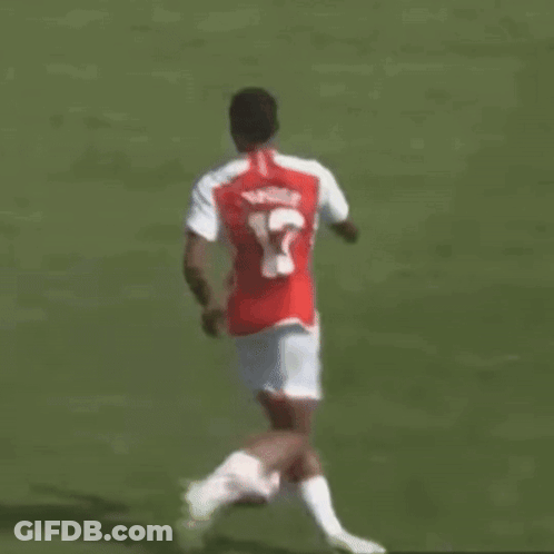 Soccer Player Number 12 Kicking Ball GIF