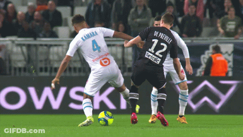 Soccer Player Number 12 Kicking Ball GIF
