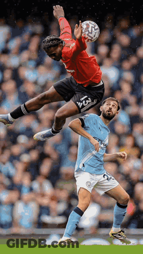 Soccer Player Number 13 Jumping To Catch Ball GIF
