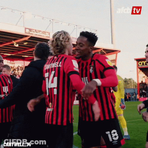 Soccer Player Number 14 Hugging Teammate GIF