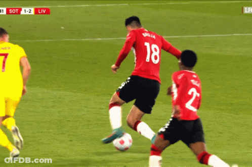 Soccer Player Number 18 Kicking Ball GIF