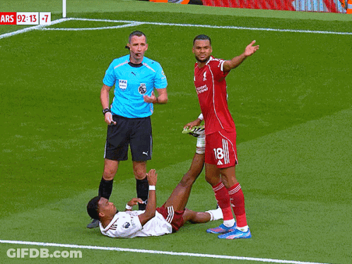 Soccer Player Number 18 Lying On Ground GIF
