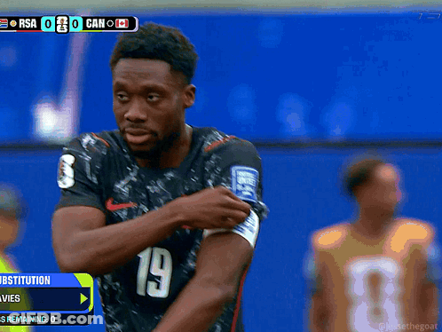Soccer Player Number 19 Adjusting Armband GIF