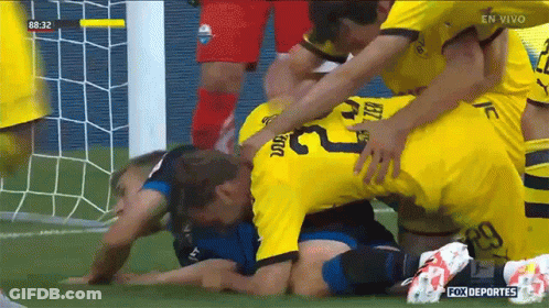 Soccer Player Number 23 Being Tackled GIF
