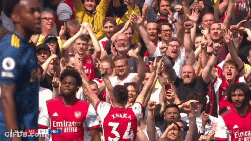 Soccer Player Number 34 Surrounded By Fans GIF