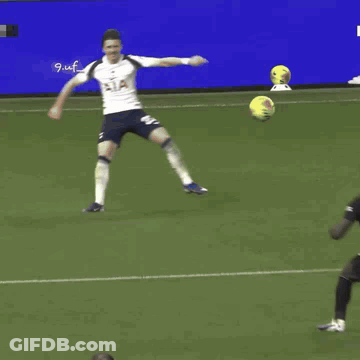 Soccer Player Number 35 Jumping To Catch Ball GIF