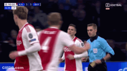 Soccer Player Number 4 In Front Of Referee GIF