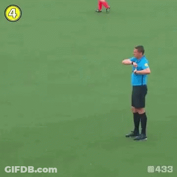 Soccer Player Number 4 Standing Next To Referee GIF