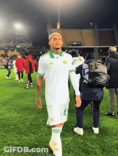 Soccer Player Number 4 Walking Off Field GIF
