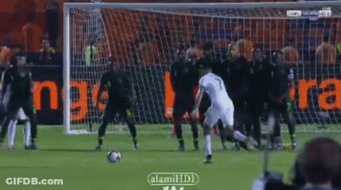 Soccer Player Number 7 Kicks Ball GIF