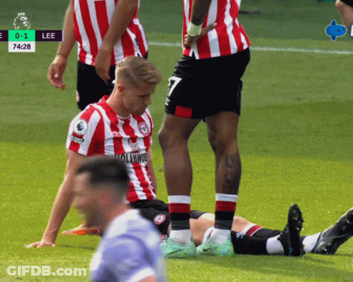 Soccer Player Number 7 Lying On Ground GIF