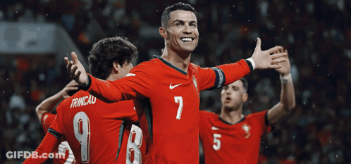 Soccer Player Number 7 Surrounded By Teammates GIF