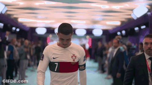 Soccer Player Number 7 Walking Through Crowd GIF
