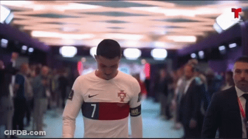 Soccer Player Number 7 Walking Through Crowd GIF
