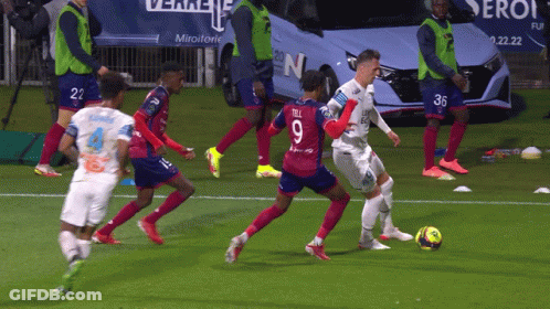 Soccer Player Number 9 Kicking Ball GIF