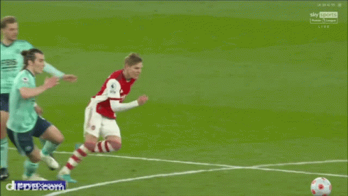 Soccer Player Number 9 Kicks Ball GIF