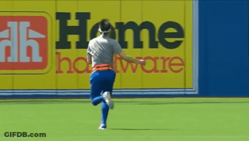 Soccer Player On Field By Home Hardware Sign GIF