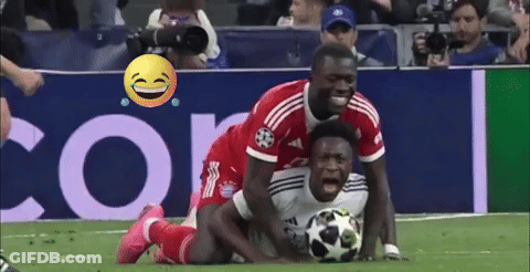 Soccer Player On Ground Opponent Tries To Get Ball GIF