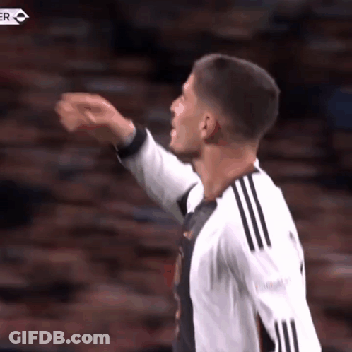 Soccer Player Pointing In Black And White Jersey GIF