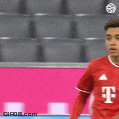 Soccer Player Red Shirt With T Looking At Another GIF