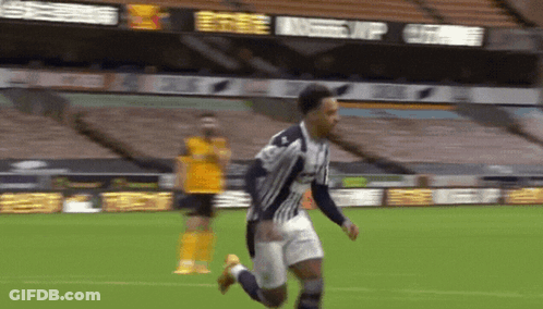 Soccer Player Running In Front Of Bwin Scoreboard GIF