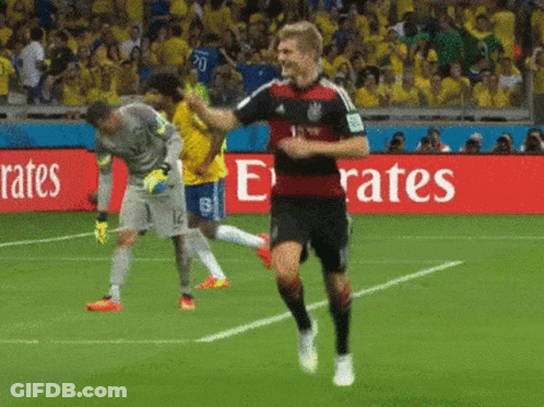 Soccer Player Running On Field In Front Of Emirates Sign GIF