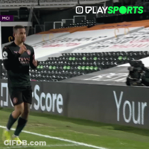 Soccer Player Running On Field With Scoreboard Sign GIF