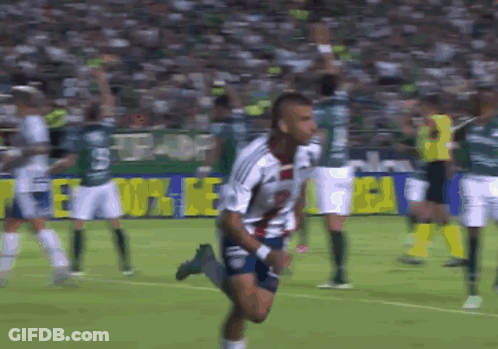 Soccer Player Running Past Everton Banner GIF
