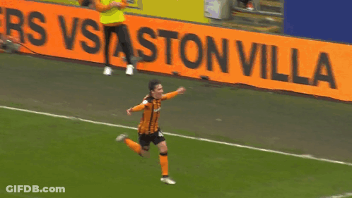 Soccer Player Running Past Ston Villa Sign GIF
