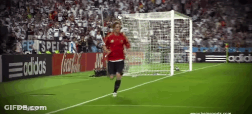 Soccer Player Running Toward Goal With Coca Cola Ad GIF