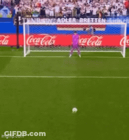 Soccer Player Running Towards Goal With Coca Cola Ads GIF