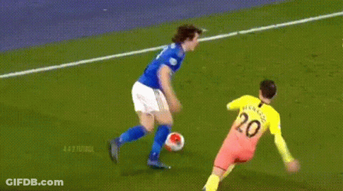 Soccer Player Running With Ball Goalie Behind GIF