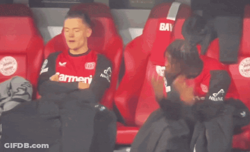 Soccer Player Sitting In Stands Red Shirt GIF