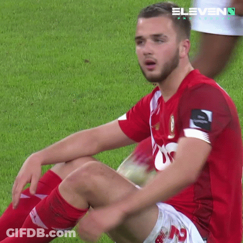 Soccer Player Sitting On Field With 11 On Jersey GIF