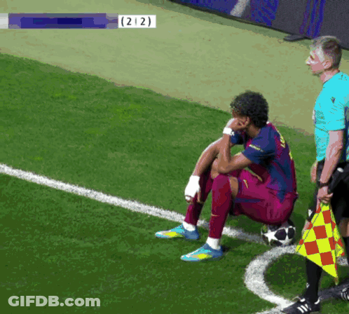 Soccer Player Sitting On Field With Number 212 GIF
