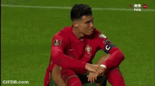 Soccer Player Sitting With Hands On Knees GIF
