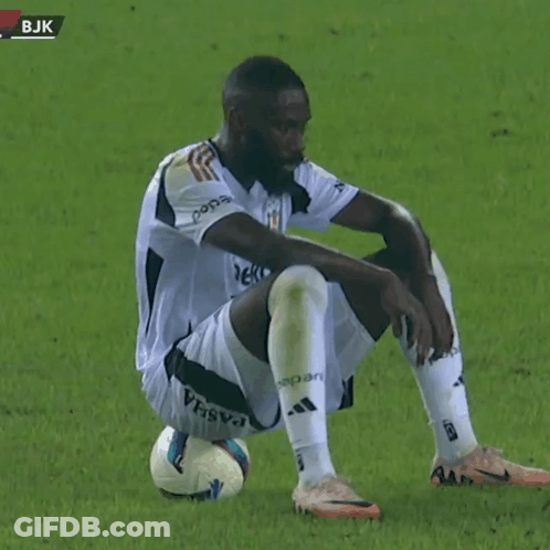 Soccer Player Sitting With Knee On Ball GIF