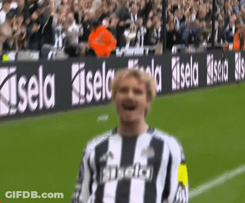 Soccer Player Standing In Front Of Kisel Sign GIF