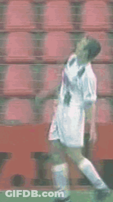 Soccer Player Standing In Front Of Red Seats GIF