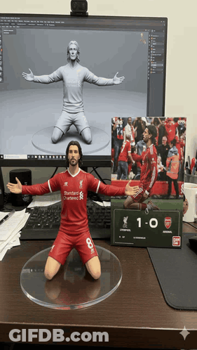 Soccer Player Statue In Red Uniform Number 8 GIF