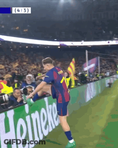 Soccer Player Stretching Leg In Front Of Heineken Ad GIF