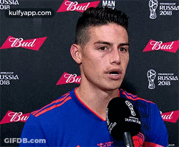 Soccer Player Talking Into Microphone At Budweiser Banner GIF
