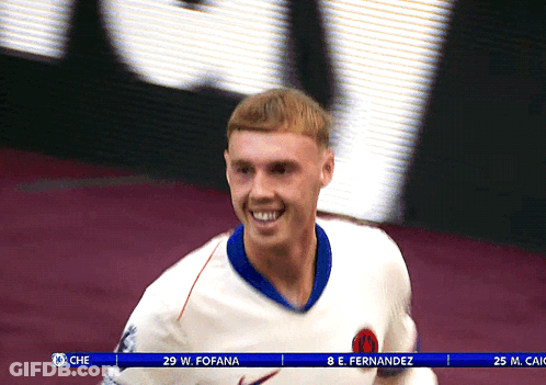 Soccer Player W. Fofana Smiling In Front Of Large Screen GIF
