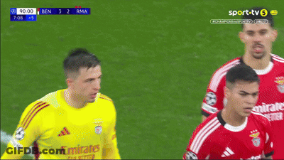 Soccer Player Wearing A Yellow Jersey That Says Emirates On The Front GIF