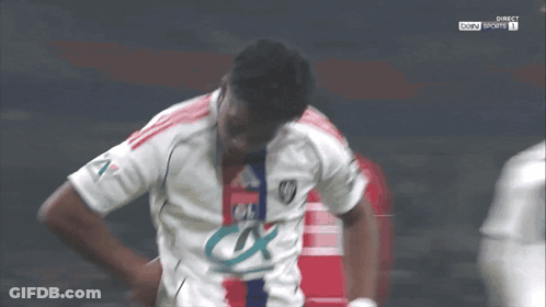 Soccer Player White Jersey Ol In Front Of Another GIF