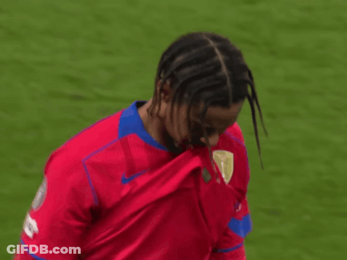 Soccer Player With Dreadlocks In Red Jersey GIF