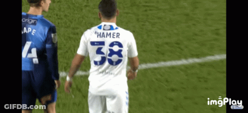 Soccer Player With Hammer On Back GIF