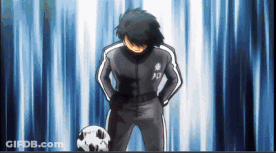 Soccer Player With Hands On Hips Beside Soccer Ball GIF